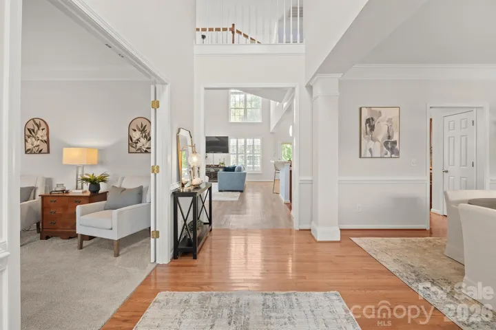 Large foyer with dining and living room flanking each side