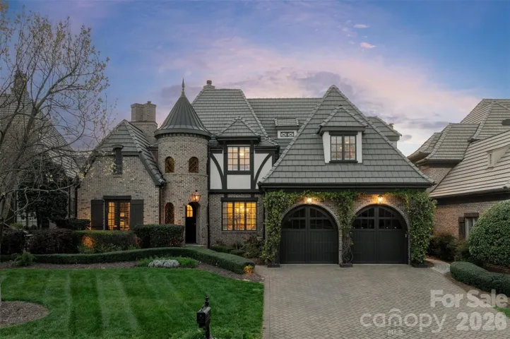 Quintessential cottage style home in gated Longview Country Club