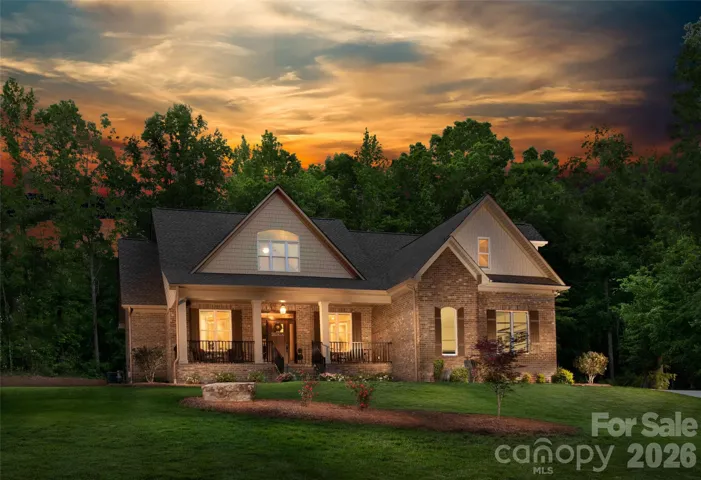 Actual twilight photo of the home before fencing and pool