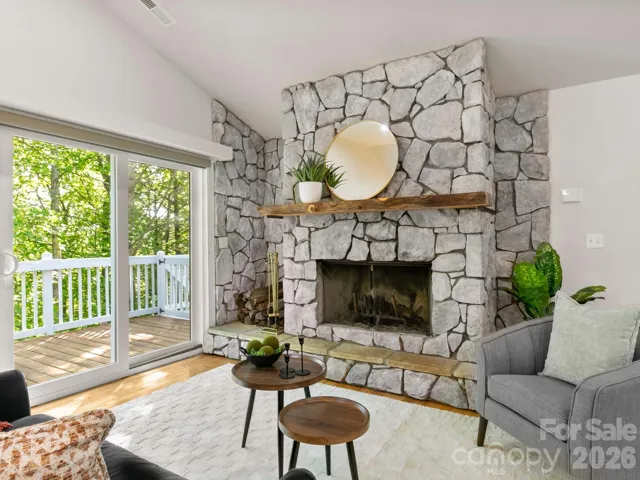 Stone fireplace in living room.