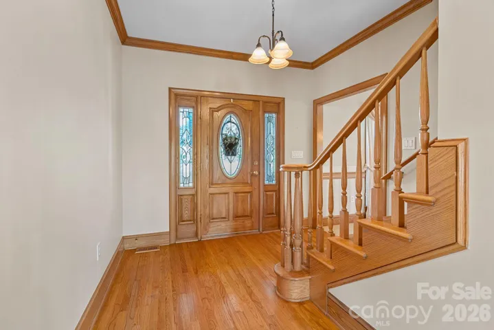 FOYER, STAIRS LEADING TO UPPER LEVEL BEDROOMS