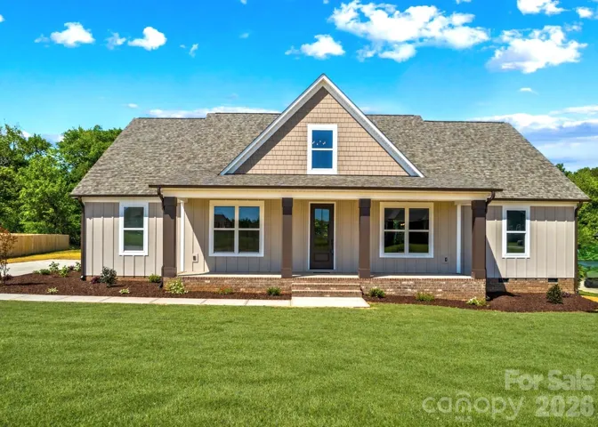 Home is all finished. Modern farmhouse with 3 Car Garage, 4 Bedrooms & 2 Bonus rooms. Grass was virtually added.
