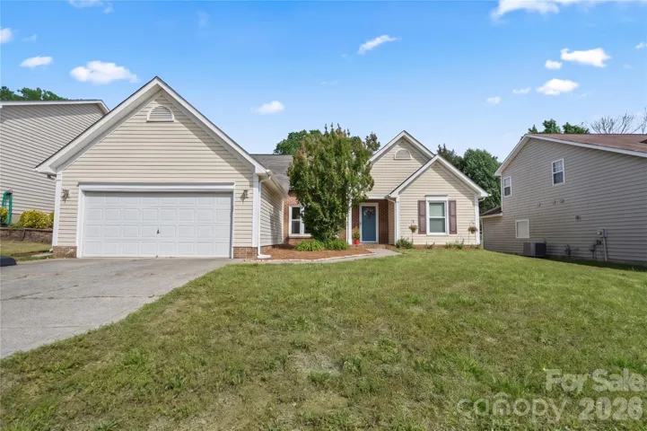 Welcome home. Classic single-story home curb appeal with a covered front porch