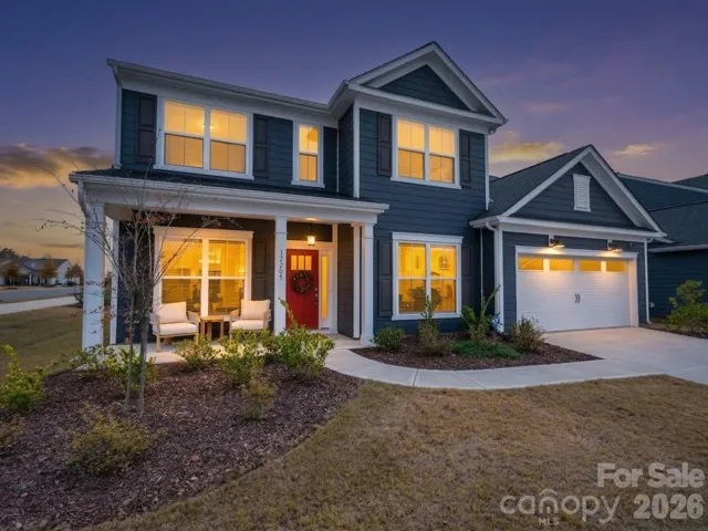 This stunning residence comes alive in the soft glow of twilight