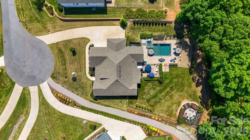 Beautifully positioned lot with a resort-style backyard, mature landscaping, pool, spa, and close access to the lake.