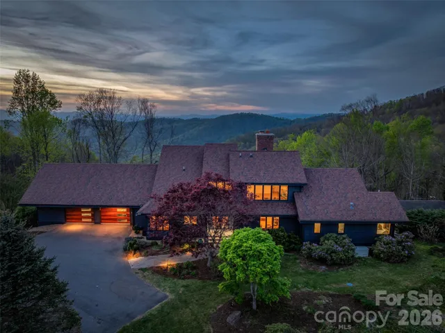 Welcome to 100 Big Spring Drive, an architecturally stunning mountain retreat set atop coveted Town Mountain, boasting unparalleled views.