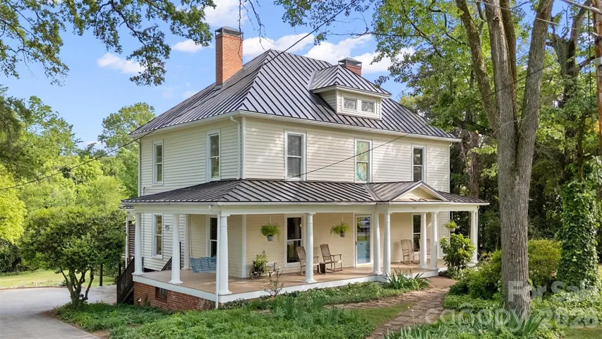 Timeless two-story Colonial Revival featuring a wraparound porch with classical columns and a pedimented entry. Ideally located just steps from Davidson College and all that downtown Davidson has to offer.