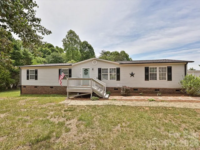 View of home from the front with oversized entry deck.