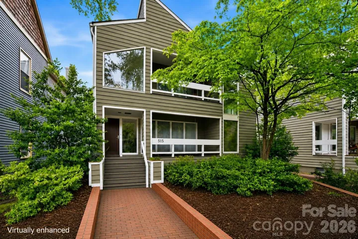 Welcoming entry framed by lush gardens and clean architectural lines (virtually enhanced)