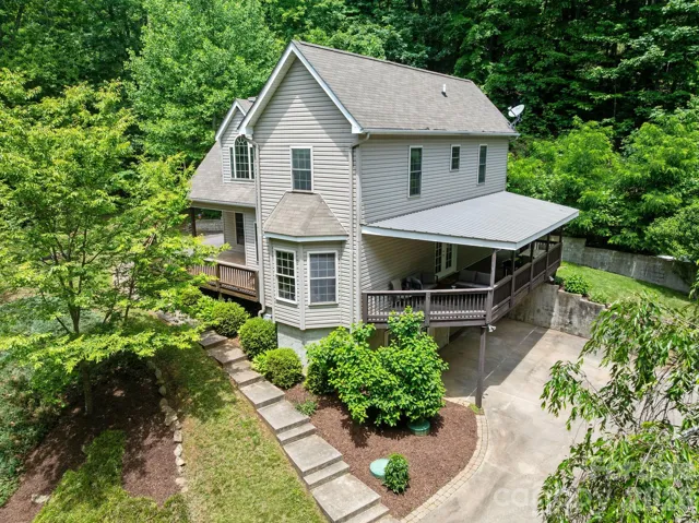 Welcome to 174 Deep Woods Trl, your private oasis tucked in the tress.