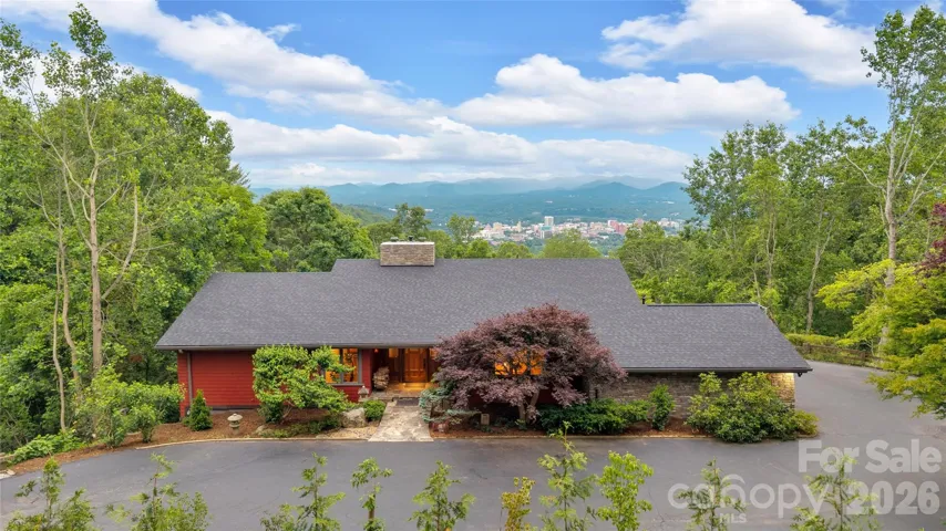This Frank Lloyd Wright-inspired Arts and Crafts home is a masterpiece, captivating from every angle, every level and every perspective!