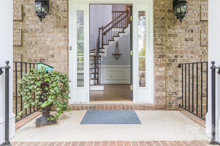 WELCOME HOME! Enter into foyer featuring staircase with hand wrought iron spindles.