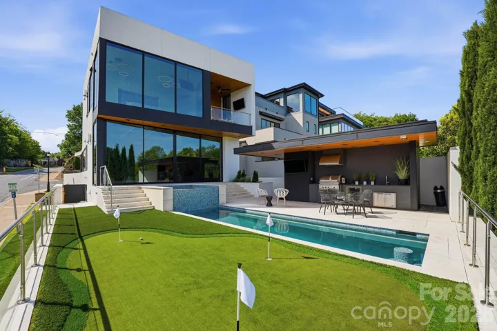 This exceptional home combines steel and glass to create a sophisticated modern home. Glass is hurricane rated.