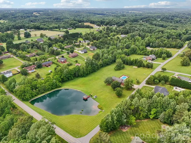 5.86 acre lot with a pond!