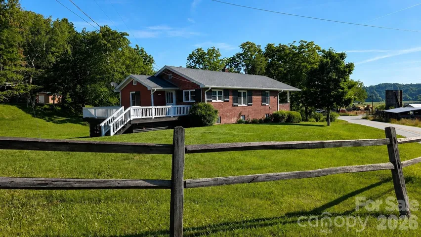 Welcome to 522 Calvert Rd! Over 1 acre of level land and in a beautful setting less than 10 minutes from downtown Brevard!