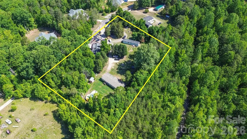 Lot lines are approximate. Three manufactured home with room for two more homes!