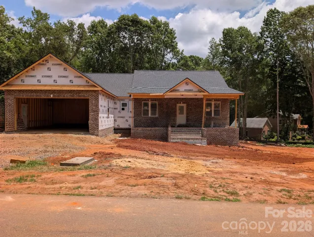 6/19 recent picture shows the brick installation on front and garage