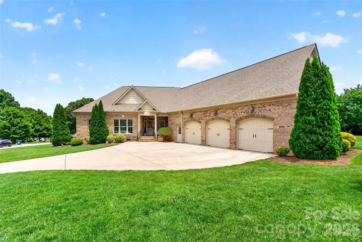 Front of home.  Three car garage.