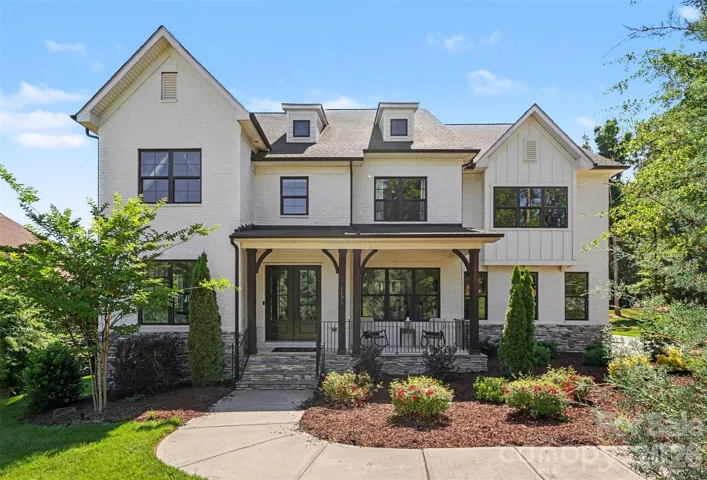 A Statement Home for a Life Well Lived!  Gorgeous full brick and stone custom in the highly desirable Fort Mill School district on a professionally landscaped acre lot