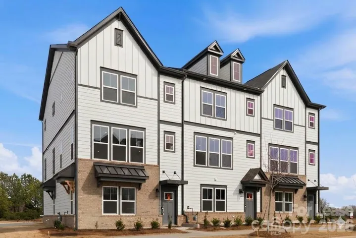 Brand new END unit townhome with tons of windows!