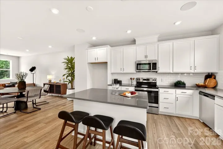 Chef-inspired kitchen with white cabinets