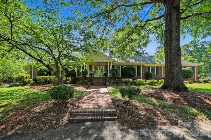 Stately brick home on a beautifully landscaped lot with brand new roof