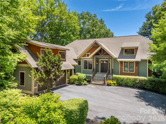 Welcome to 161 Chattooga Run. Mountain living framed by golf course views and cascading waterfall