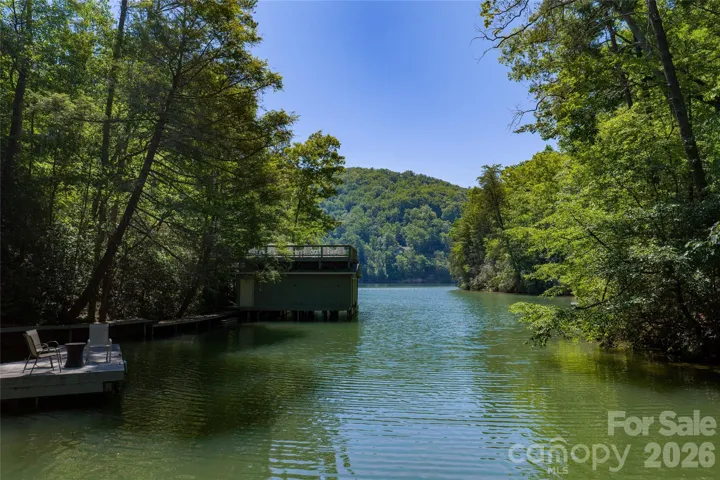 Lake front lot on Lake Lure in a quiet cove behind the gates of the Rumbling Bald on Lake Lure