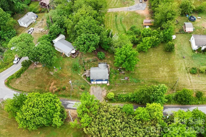 Aerial view showing the two houses and buld lot