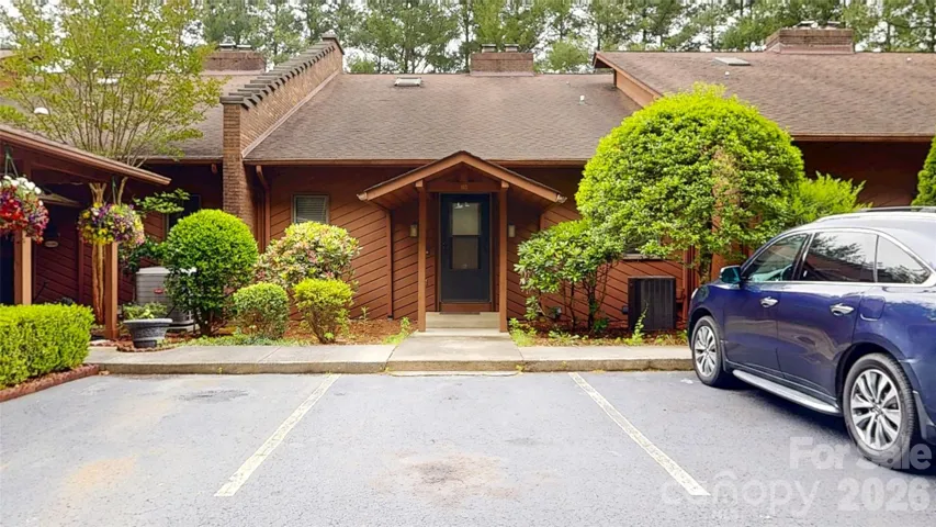 Front of unit. Three parking spaces assigned to this unit shown