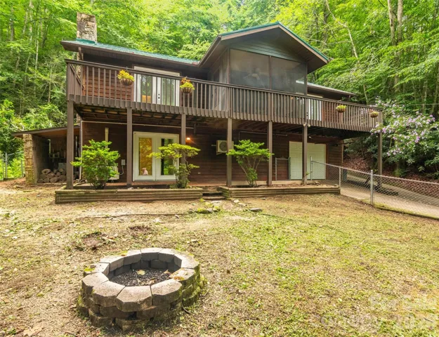House and front yard with its front yard firepit.