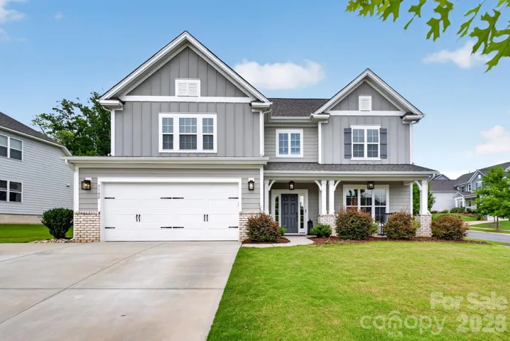 Professional $3,000 luxury exterior soffit lighting by Charlotte Tri Light for striking evening curb appeal.