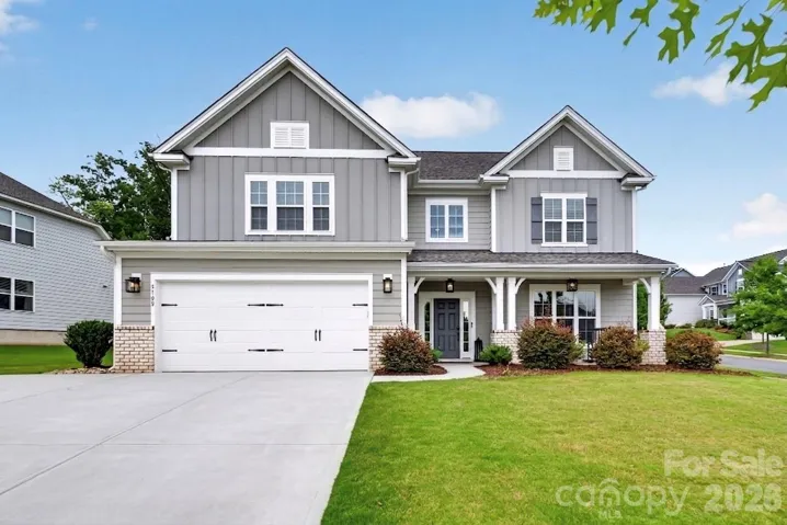Professional $3,000 luxury exterior soffit lighting by Charlotte Tri Light for striking evening curb appeal.