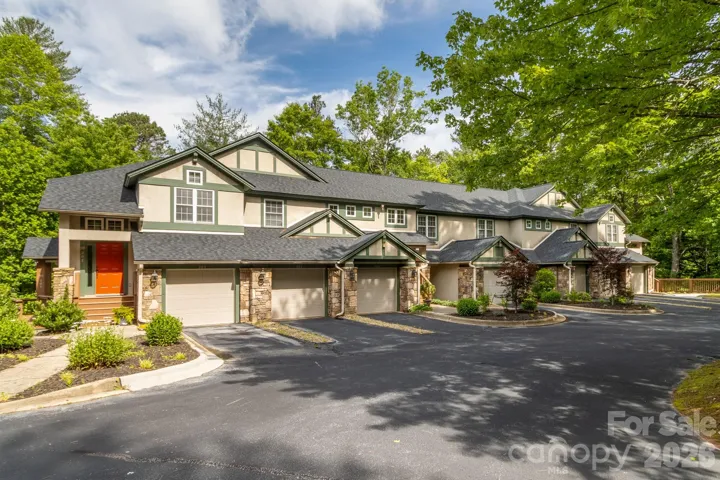 Building Exterior & Setting – Endearing mountain-inspired architecture surrounded by mature trees and professionally maintained grounds.