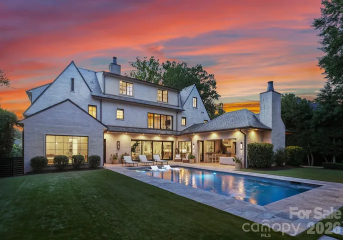Rear view of the backyard, featuring the pool and cabana.