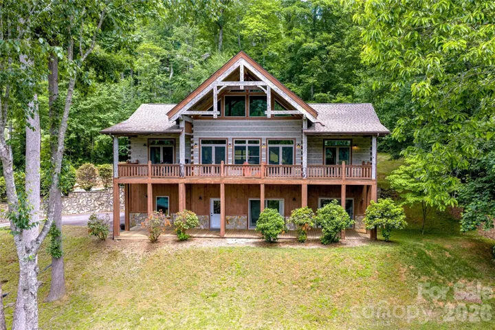 Covered porches extend across the full length on two levels at 17 Cradling Cove, Waynesville NC