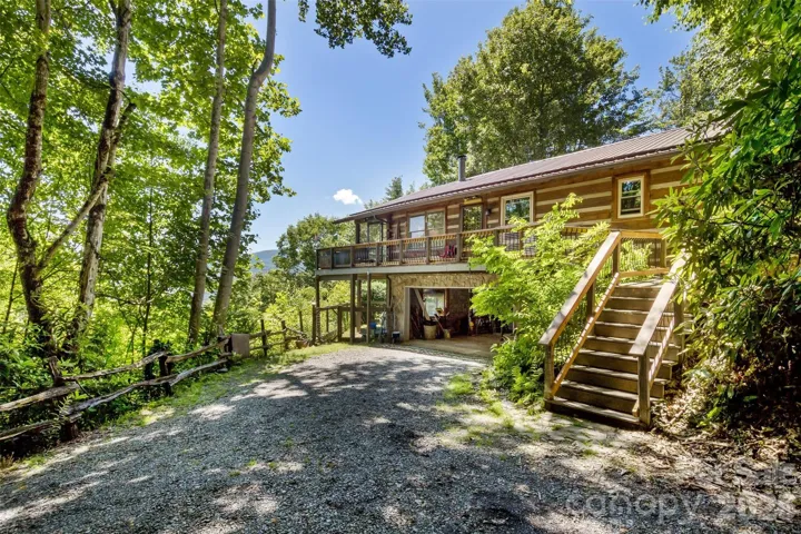Front of home with long drive and privacy