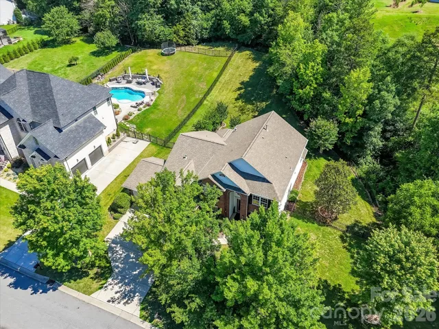 Nestled in the prestigious Verdict Ridge golf community, this beautifully maintained brick-front home offers exceptional curb appeal, a spacious three-car garage, and mature landscaping in one of Denver's most sought-after neighborhoods.