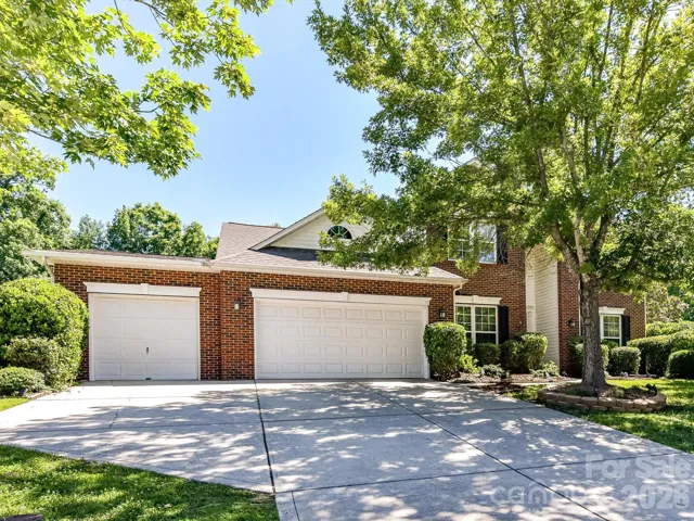 Nestled in the prestigious Verdict Ridge golf community, this beautifully maintained brick-front home offers exceptional curb appeal, a spacious three-car garage, and mature landscaping in one of Denver's most sought-after neighborhoods.