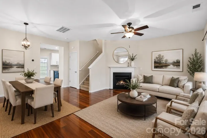 Living/Dining Area - This image has been digitally enhanced with virtual staging for illustrative purposes only.