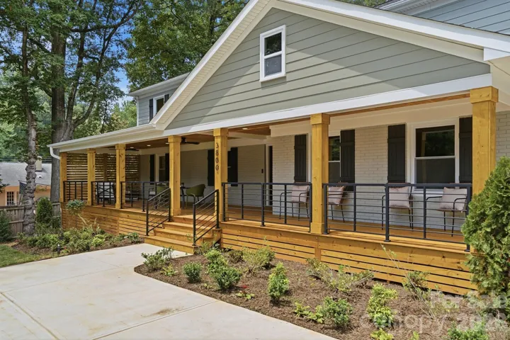 New extended driveway with extra front parking area, Front porch is 12 feet deep and the length of the entire house