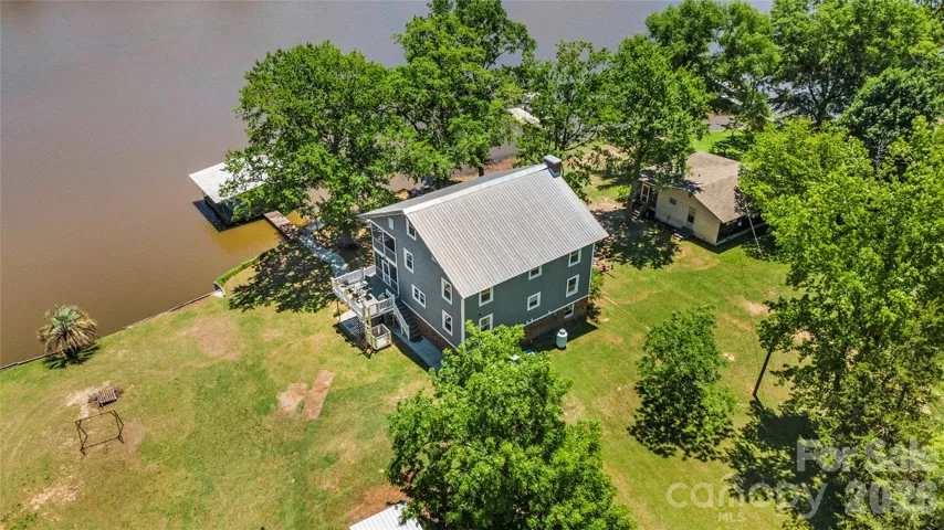 6 bedrooms and 3.5 bathrooms on the water with a double slip covered dock and boat ramp