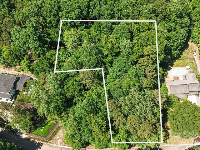 Discover the perfect blend of privacy and convenience on this beautiful 1-acre wooded homesite in The Preserve at Cold Water Creek, surrounded by mature trees and established custom homes.
