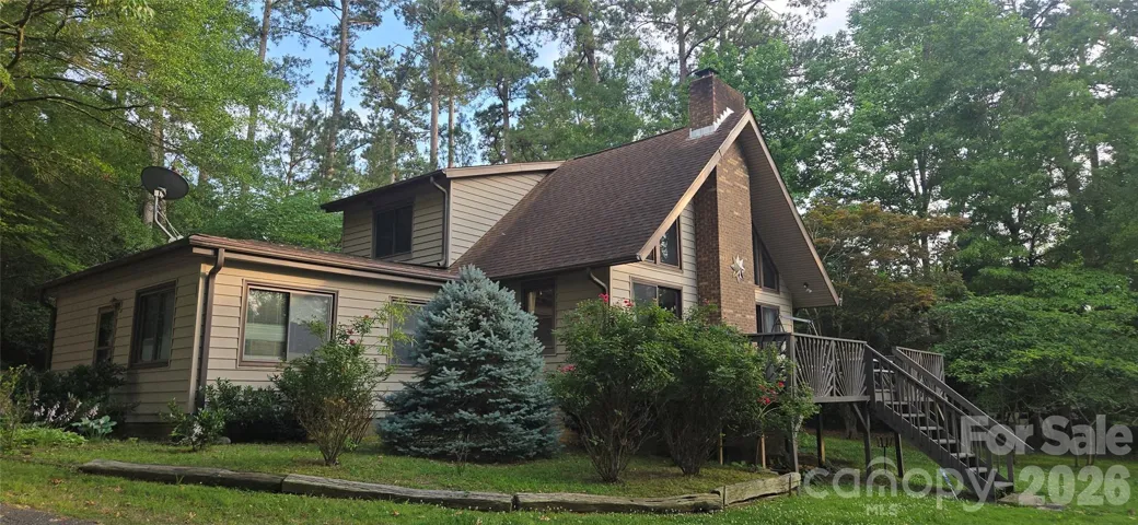 Lot is .87+/- of an acre, with over 200 feet of shoreline!  NO HOA!