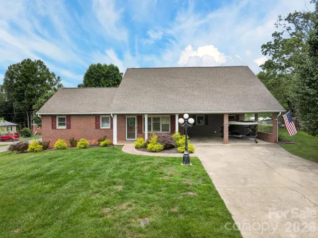 All brick home with two covered parking spaces in carport