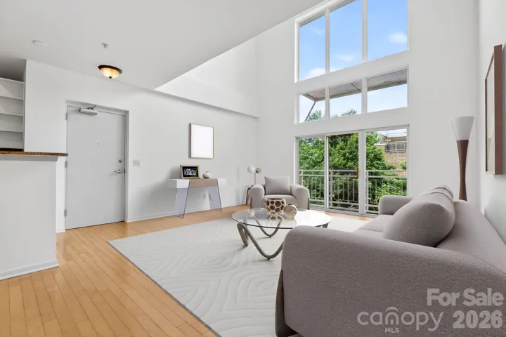 Gigantic Loft style windows flood the space with natural light, virtually staged