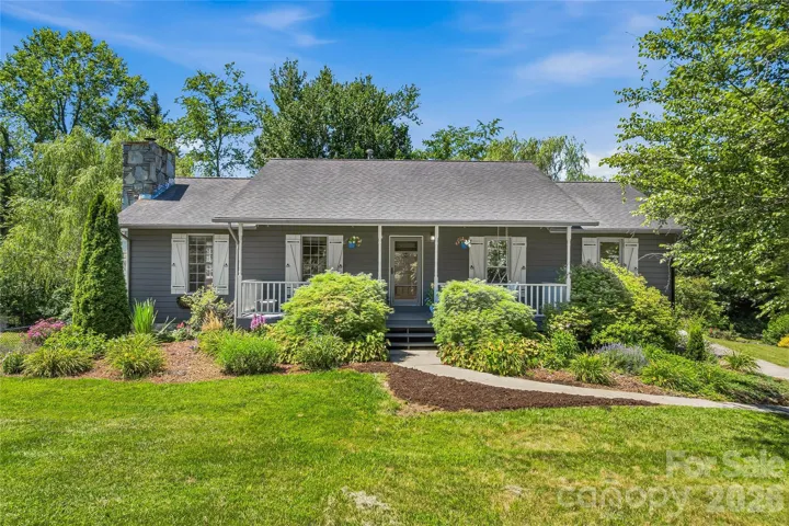 Attractive cedar-sided home on 1.16± acres with mature landscaping and inviting curb appeal.