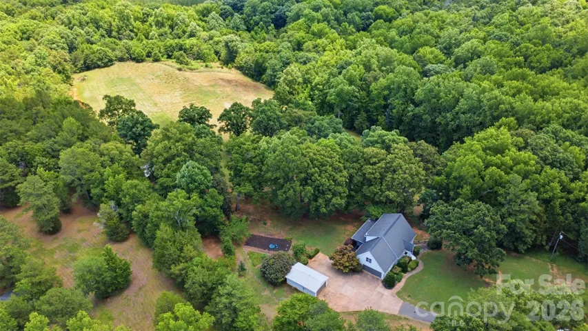 Aerial of entire property facing away from road