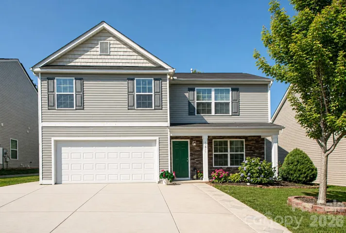 Welcome to this 5 bedroom, 3 full bathroom home with expanded driveway and stone in the front.