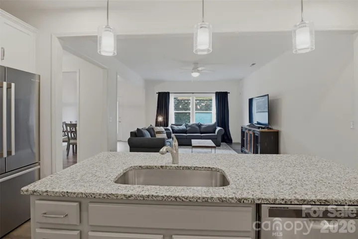 Great seating at the breakfast bar for casual meals or snacks!  Deep single stainless steel sink